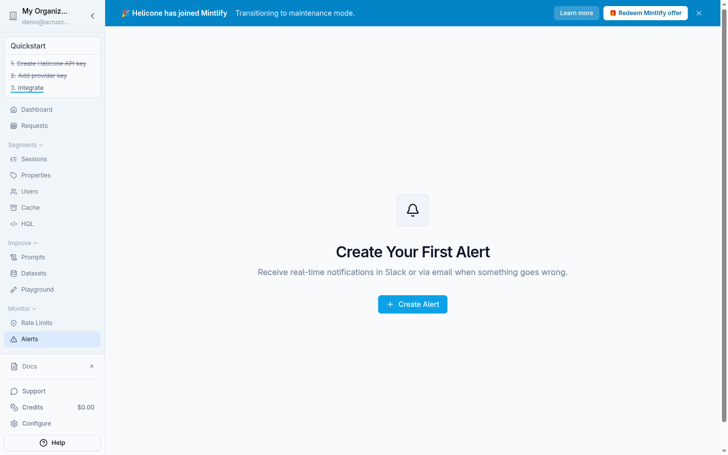 Helicone's Alerts empty state: "Create Your First Alert — Receive real-time notifications in Slack or via email when something goes wrong," with a Create Alert button